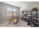 This bedroom showcases shelves, a drum set, guitar, and keyboard creating a comfortable area at 5240 Bristlecone Pine Way, Cumming, GA 30040