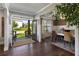 Open-concept dining area with hardwood floors, stylish decor, and easy access to the front porch at 5240 Bristlecone Pine Way, Cumming, GA 30040
