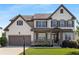Charming two-story home featuring a brick and siding exterior, well-manicured lawn and a two-car garage at 5240 Bristlecone Pine Way, Cumming, GA 30040