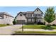 Charming two-story home featuring a brick and siding exterior, well-manicured lawn and a two-car garage at 5240 Bristlecone Pine Way, Cumming, GA 30040