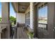 Inviting front porch showcasing decorative stone accents, and a seating area to enjoy the outdoors at 5240 Bristlecone Pine Way, Cumming, GA 30040