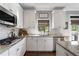 Charming kitchen featuring granite counters, stainless steel appliances, and white subway tile backsplash at 5240 Bristlecone Pine Way, Cumming, GA 30040