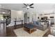 Comfortable living room flows into the dining area and kitchen with views of the front door at 5240 Bristlecone Pine Way, Cumming, GA 30040