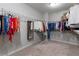 Spacious walk-in closet with carpeted floor, wire shelving and hanging racks offer plenty of storage at 5240 Bristlecone Pine Way, Cumming, GA 30040