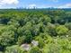 Enjoy stunning aerial views of Atlanta skyline from this home nestled amongst a canopy of trees at 582 Lakeshore Ne Dr, Atlanta, GA 30307