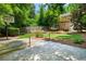Backyard with artificial turf, basketball court, and multi-level deck at 582 Lakeshore Ne Dr, Atlanta, GA 30307