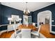 Navy dining room with hardwood floors and view into the living room and stairwell at 582 Lakeshore Ne Dr, Atlanta, GA 30307