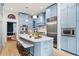 Spacious kitchen featuring a large island with seating and stainless steel appliances at 582 Lakeshore Ne Dr, Atlanta, GA 30307