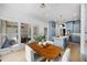 Open kitchen and dining area with blue cabinets, stainless steel appliances, and wood floors at 582 Lakeshore Ne Dr, Atlanta, GA 30307