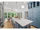 Well-lit kitchen with a central island, ample storage, and stainless steel appliances at 582 Lakeshore Ne Dr, Atlanta, GA 30307