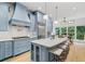 Spacious kitchen with blue cabinets, a large island, and stainless steel appliances at 582 Lakeshore Ne Dr, Atlanta, GA 30307