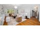 Bright living room features hardwood floors, stylish furniture, and staircase at 582 Lakeshore Ne Dr, Atlanta, GA 30307