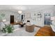 Bright living room with hardwood floors, fireplace, view into the kitchen and neutral decor at 582 Lakeshore Ne Dr, Atlanta, GA 30307