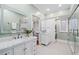 Bright main bathroom features dual vanity sinks, a soaking tub and a walk-in shower at 582 Lakeshore Ne Dr, Atlanta, GA 30307