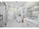 Spacious main bathroom featuring dual vanity sinks, stylish mirrors and walk-in shower at 582 Lakeshore Ne Dr, Atlanta, GA 30307