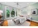 Relaxing main bedroom with plush carpeting, natural light, ceiling fan and scenic backyard views at 582 Lakeshore Ne Dr, Atlanta, GA 30307