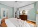 Relaxing main bedroom featuring hardwood floors, ceiling fan, and natural light at 582 Lakeshore Ne Dr, Atlanta, GA 30307