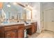 Spacious bathroom featuring double sinks, granite countertop, and access to the shower at 6255 Hedgestone Way, Douglasville, GA 30135