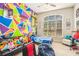 bedroom with colorful wall art and a large window allowing natural light at 6255 Hedgestone Way, Douglasville, GA 30135