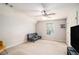 Neutral bedroom with a sofa, ceiling fan, and a window at 6255 Hedgestone Way, Douglasville, GA 30135