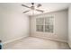 Empty bedroom with a ceiling fan and a window with blinds at 6255 Hedgestone Way, Douglasville, GA 30135