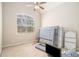 Bedroom features a ceiling fan and a large window that provides natural light at 6255 Hedgestone Way, Douglasville, GA 30135