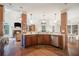 Open-concept kitchen featuring dark wood cabinets, granite countertops, and stainless steel appliances at 6255 Hedgestone Way, Douglasville, GA 30135
