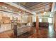 Open layout combining kitchen and living space, featuring a kitchen island and rustic ceiling detail at 6255 Hedgestone Way, Douglasville, GA 30135