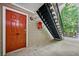 Attractive front door of a multi-Gathering property with nearby exterior staircase at 1468 Briarwood Ne Rd # 406, Brookhaven, GA 30319