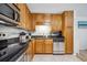Updated kitchen featuring stainless steel appliances, solid countertops, and light wood cabinets at 1468 Briarwood Ne Rd # 406, Brookhaven, GA 30319