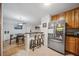 Well-lit kitchen features stainless steel appliances and a bar with seating at 1468 Briarwood Ne Rd # 406, Brookhaven, GA 30319