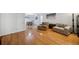 Spacious living room featuring wood floors, comfortable seating, and a view of the dining area at 1468 Briarwood Ne Rd # 406, Brookhaven, GA 30319
