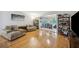 Comfortable living room with wood floors, plush couches, and an open layout to the office at 1468 Briarwood Ne Rd # 406, Brookhaven, GA 30319