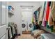 Spacious walk-in closet with clothing racks and in-unit washer and dryer at 1468 Briarwood Ne Rd # 406, Brookhaven, GA 30319