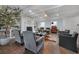 Bright living room boasts high ceilings, wood floors, fireplace, and comfortable seating arrangement at 167 Garden Ln, Decatur, GA 30030