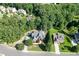 Aerial view of a beautiful neighborhood with mature trees and well-manicured lawns at 1777 Water Springs Way, Dacula, GA 30019