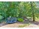 Large backyard with mature trees, trampoline and play set at 1777 Water Springs Way, Dacula, GA 30019