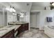 Lavish bathroom boasting dual sinks, granite countertops, and a separate tub at 1777 Water Springs Way, Dacula, GA 30019