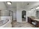 Primary bathroom showcases a soaking tub, separate shower, dual vanities, and private access to main bedroom at 1777 Water Springs Way, Dacula, GA 30019