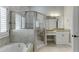 Bathroom featuring a glass shower, vanity with granite countertops, and tub at 1777 Water Springs Way, Dacula, GA 30019