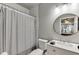 Cozy bathroom features a vanity with granite countertops and a tub/shower at 1777 Water Springs Way, Dacula, GA 30019