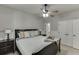 Cozy bedroom features a comfortable bed with decorative pillows, side tables, and a ceiling fan for a relaxing atmosphere at 1777 Water Springs Way, Dacula, GA 30019