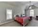 A traditional bedroom boasts gray walls, two beds and a ceiling fan at 1777 Water Springs Way, Dacula, GA 30019
