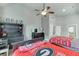 Cozy bedroom featuring ceiling fan, decor, and matching comforters at 1777 Water Springs Way, Dacula, GA 30019