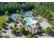 Aerial view of community amenities including tennis courts, swimming pool, and playground at 1777 Water Springs Way, Dacula, GA 30019