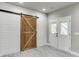 Charming interior with wood sliding barn door and access to the outside at 1777 Water Springs Way, Dacula, GA 30019