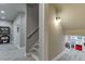 Hallway with stairs and playroom featuring a toy kitchen at 1777 Water Springs Way, Dacula, GA 30019