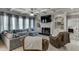 Comfortable living room with coffered ceiling, fireplace, built-in shelves, and plush seating at 1777 Water Springs Way, Dacula, GA 30019