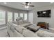 Bright living room with a comfy sectional sofa and lots of natural light at 1777 Water Springs Way, Dacula, GA 30019