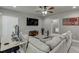 Spacious living room with neutral tones, television, and a large sectional sofa at 1777 Water Springs Way, Dacula, GA 30019